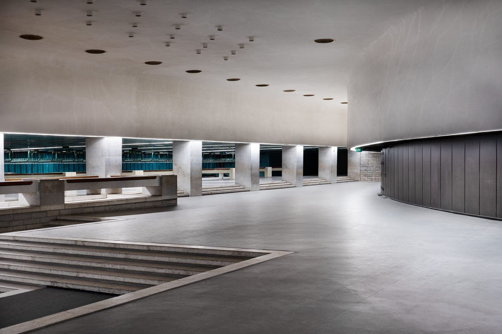 An empty hall with a hard floor and bare walls