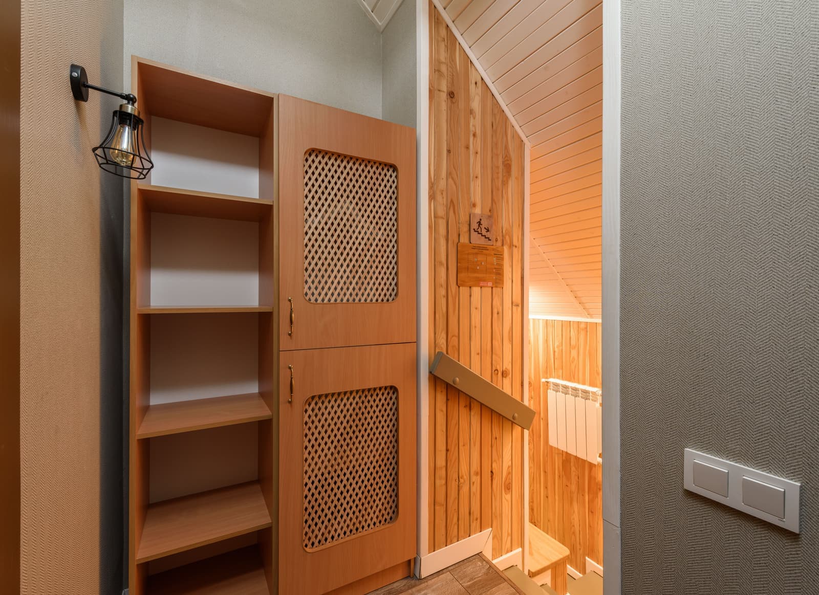A storage cabinet and an open shelving unit standing side by side