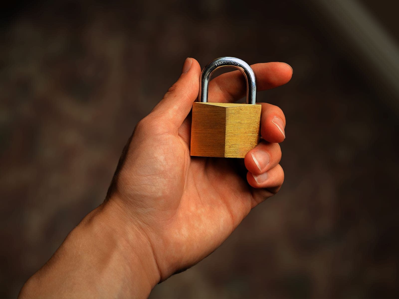 A closed padlock resting on a document